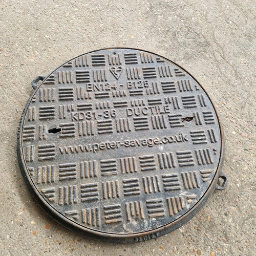 Round cast iron manhole cover - cast,