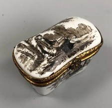 A 19thc enamel box, hand painted with a figure in a wooded landscape.