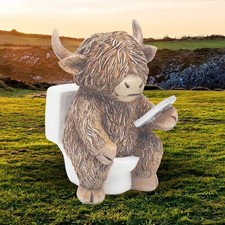 RUSTIC SITTING HIGHLAND COW