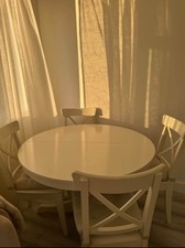 round wooden dining table and 4 chairs adjustable with 4 chair pads