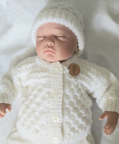 Hand knitted baby - hand,