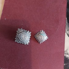 PAIR OF WHITE METAL OFFICER'S PIPS. IN UNO TRIA JUNCTA