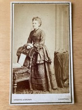CDV: Woman standing against a