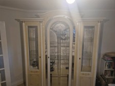 Used high gloss Italian display cabinet in white-cream color.