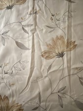 A Pair Of Beige Lined Curtains