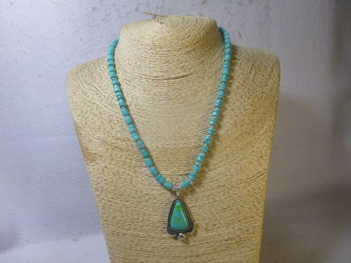 Turquoise and silver pendant - and,
