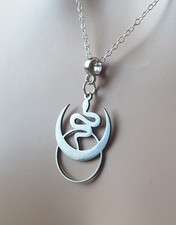 Horned Moon, Sun and Serpent