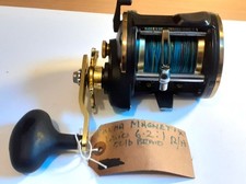 OKUMA MAGNETIX MG-45LS LEVEL WIND  BOAT REEL LOADED WITH 50LB BRAID