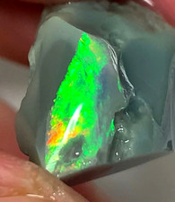 Oversaturated Vibrant Bar Exposed on Semi Black Seam Opal. Australian Opal