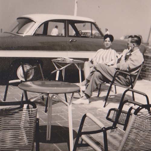 Empty chairs foreground couple - empty,