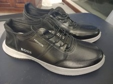 A pair of Men s  Black Boss Training Shoes