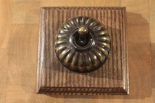 Reproduction brass dolly-rocker light switch,