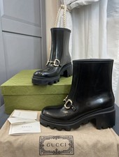 Black Gucci horsebit rainboots