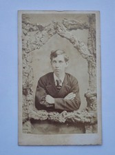 CDV OF MAN FRAMED BY WOODEN