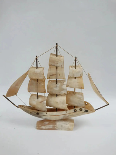 Hand carved cow horn sailing - cow,