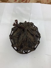 A Vintage Clear Glass Fishing Net Float Buoy Ball in Netting with original Tar
