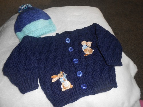 Hand knitted blue bunny - hand,
