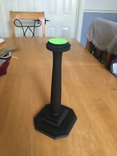 A helmet and hat display stand , solid wood ,12” tall.felted and stained .