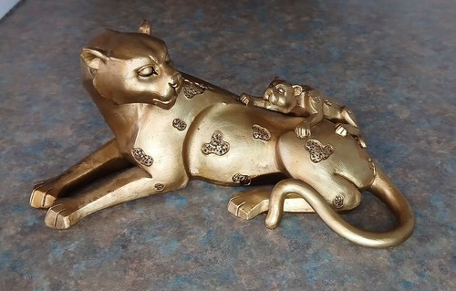 Gold coloured leopard - coloured,