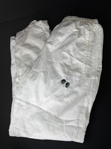 White lawn bowls - lawn, trousers
