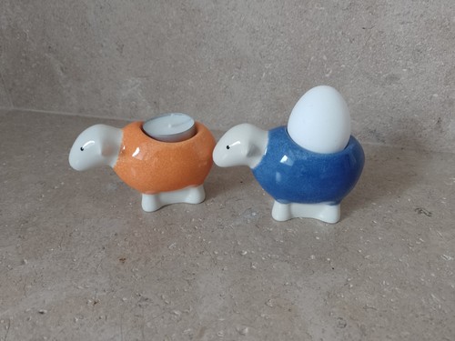Two herdy eggcups orange and - two,