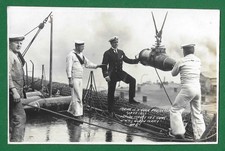 EARLY 20TH CENTURY WWI RP POSTCARD, HMS QUEEN MARY TAKING ON A HUGE PROJECTILE.