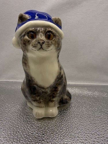 Winstanley tabby cat - winstanley, sitting