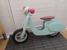 Childs wooden Janod balance bike.