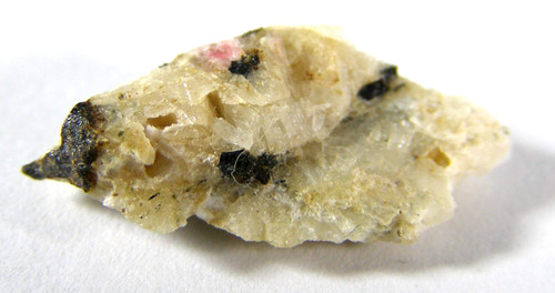Tiny rare tugtupite piece - &,