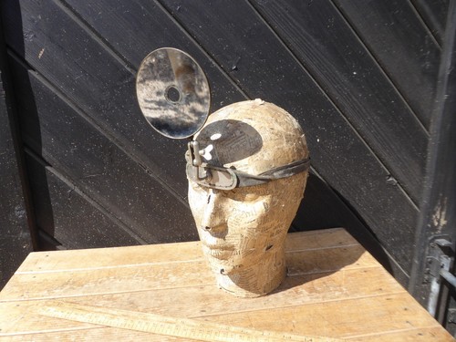 Antique doctors head mirror - head,