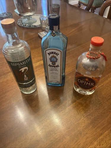 Three empty assorted - empty, gin