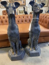 PAIR OF CAST IRON DOG SCULPTURES. LURCHERS.