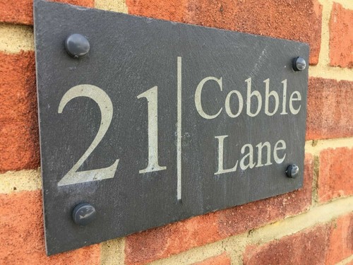 Rustic slate house - gate, sign