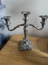 Ornate silver-plated triple