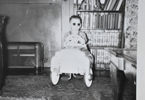 Boy riding pedal car wearing - pedal,