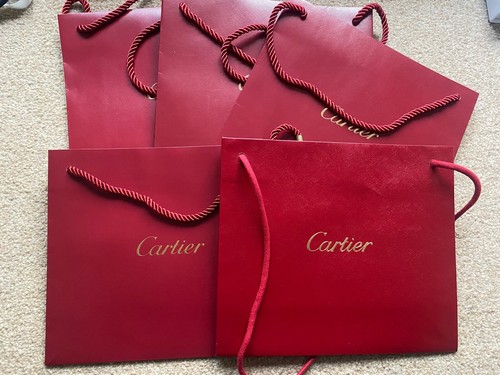Five cartier carrier bags - cartier,