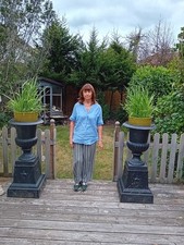 Pair of Cast Iron Urns of Campana Form.