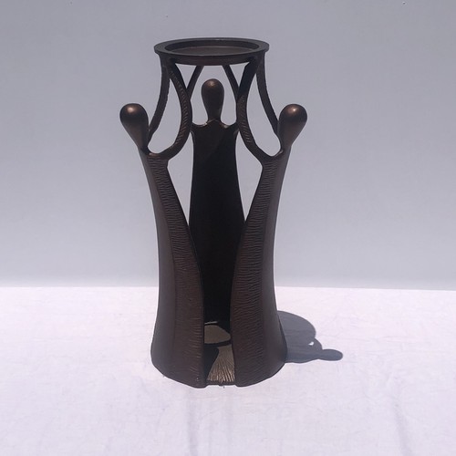 Cast metal piece - cast, figural