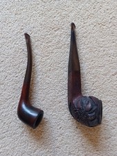  2 smoking pipes, a pipe stand, a dummy pipe, and pipe cleaning instruments 