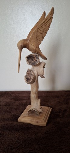 Hand carved wooden hummingbird - hand,
