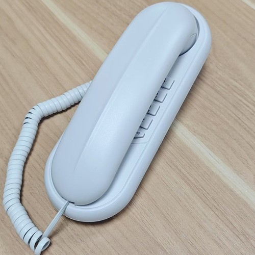 Wall mounted corded telephone - mounted,