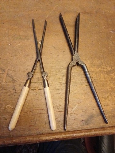 Two vintage steel curling - two,