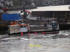 Photo 12x8 A workboat moored
