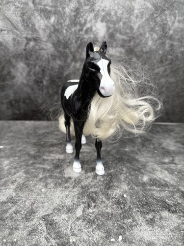 Small black and white doll - black,
