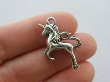 4 Unicorn charms antique