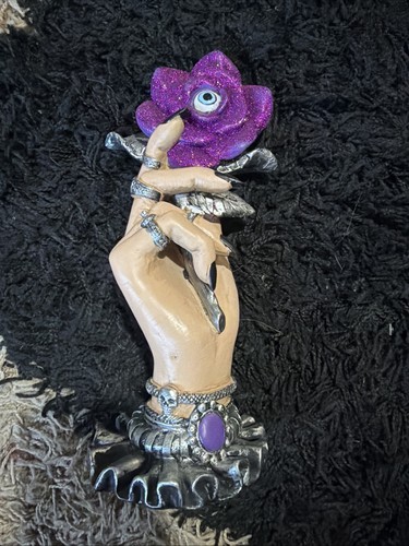 Hand holding purple rose with - holding,