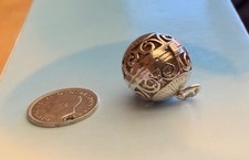 VINTAGE OPENING ARTICULATED CIRCUS ORB,GIRL ON TRAPEZE IN SIDE SILVER CHARM.4.8g