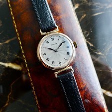 AN ANTIQUE 1925 9K GOLD ROLEX