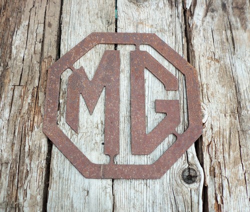 Rusty metal badge sign - mg,
