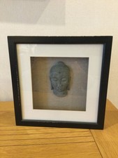 Framed Buddha Wall Art in Relief, set in a black frame in good condition